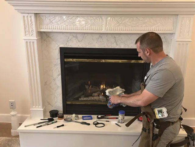 Marblehead Chimney Sweep performing fireplace maintenance in Marblehead, MA