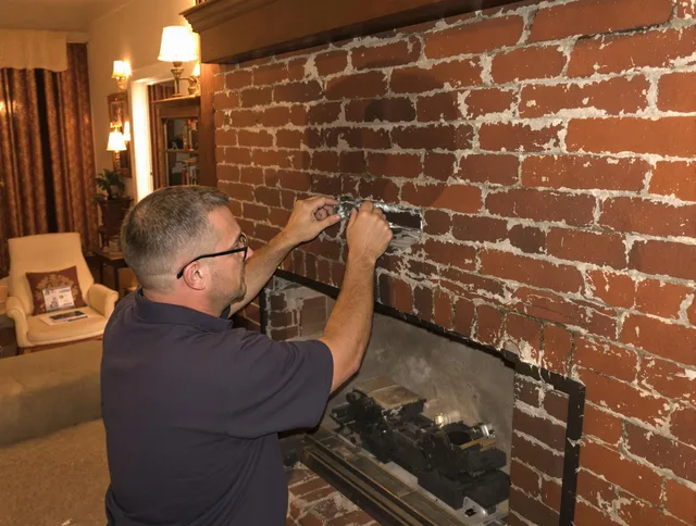 Marblehead Chimney Sweep expert fixing a fireplace in Marblehead, MA